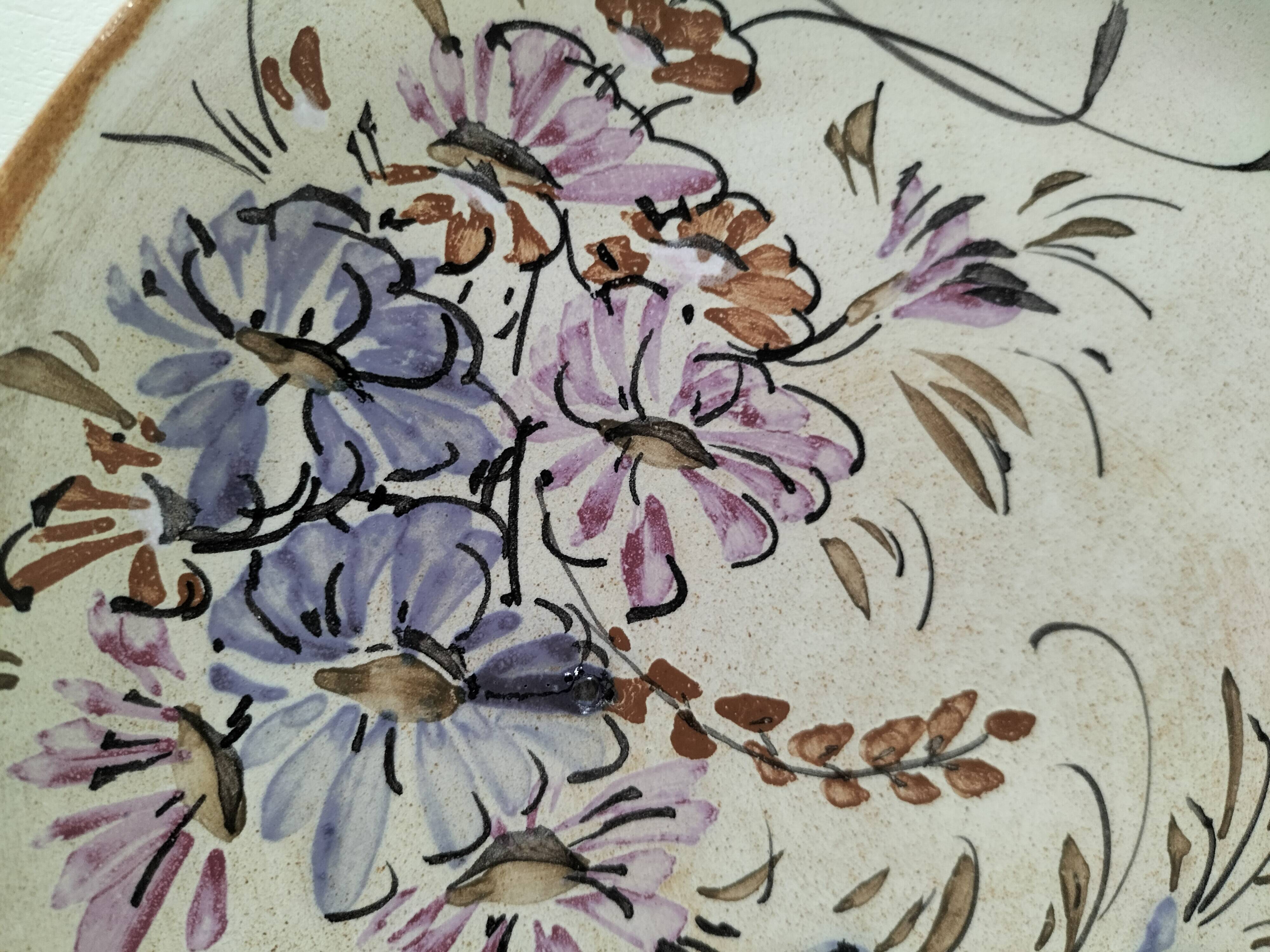 Stoneware plate with hand-painted floral decoration