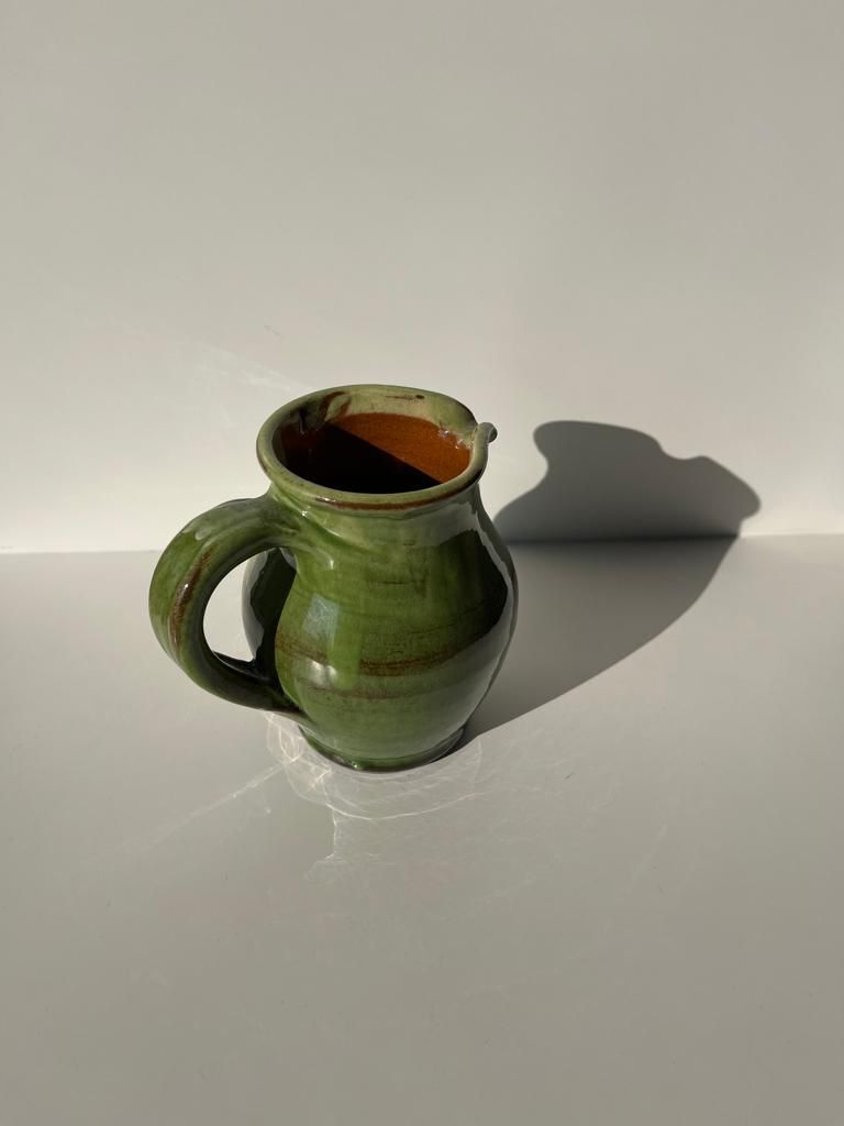 Green glazed ceramic pitcher