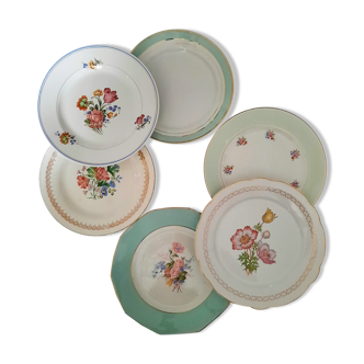 Pitted old flat earthenware plates with gold