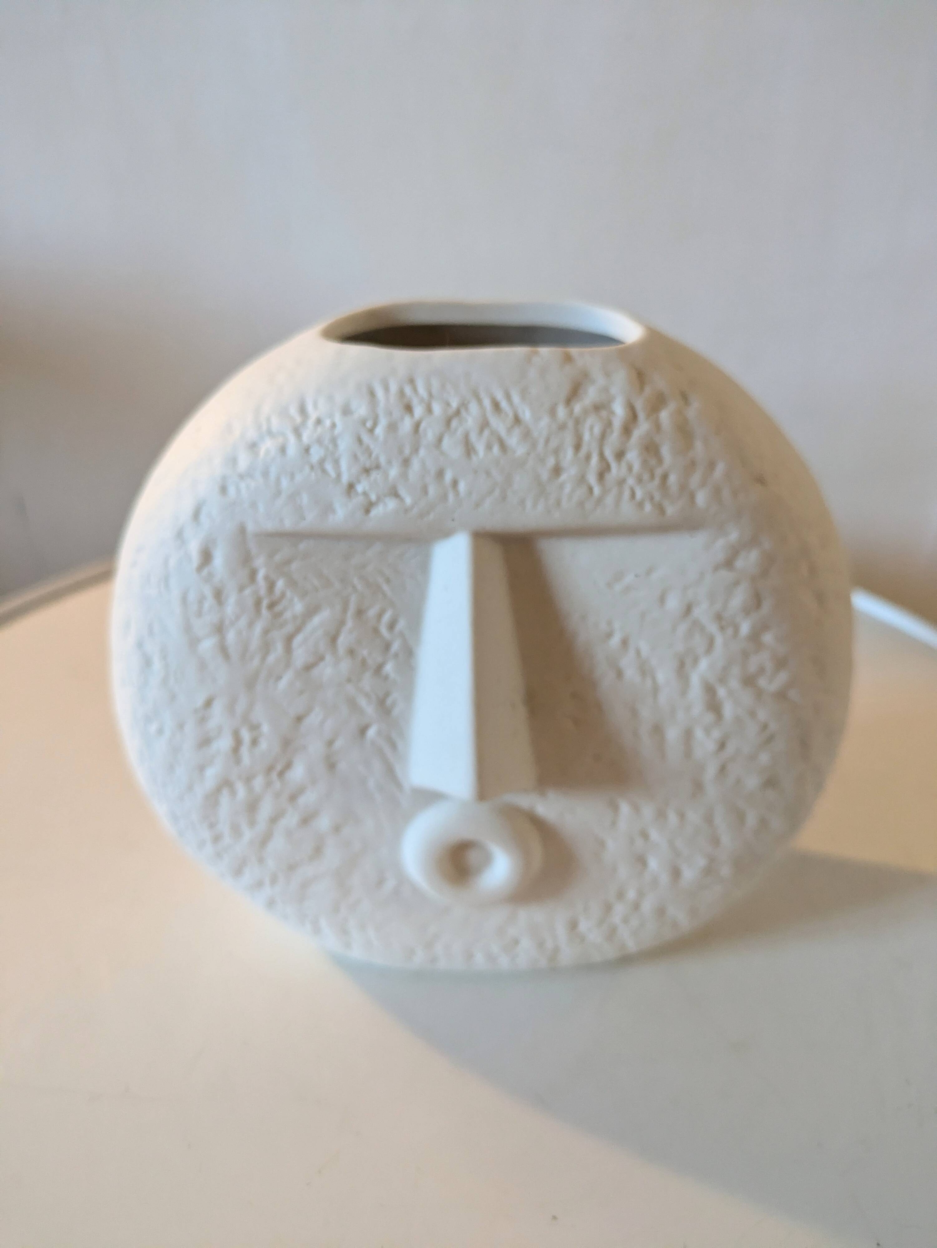 Stylized face biscuit vase