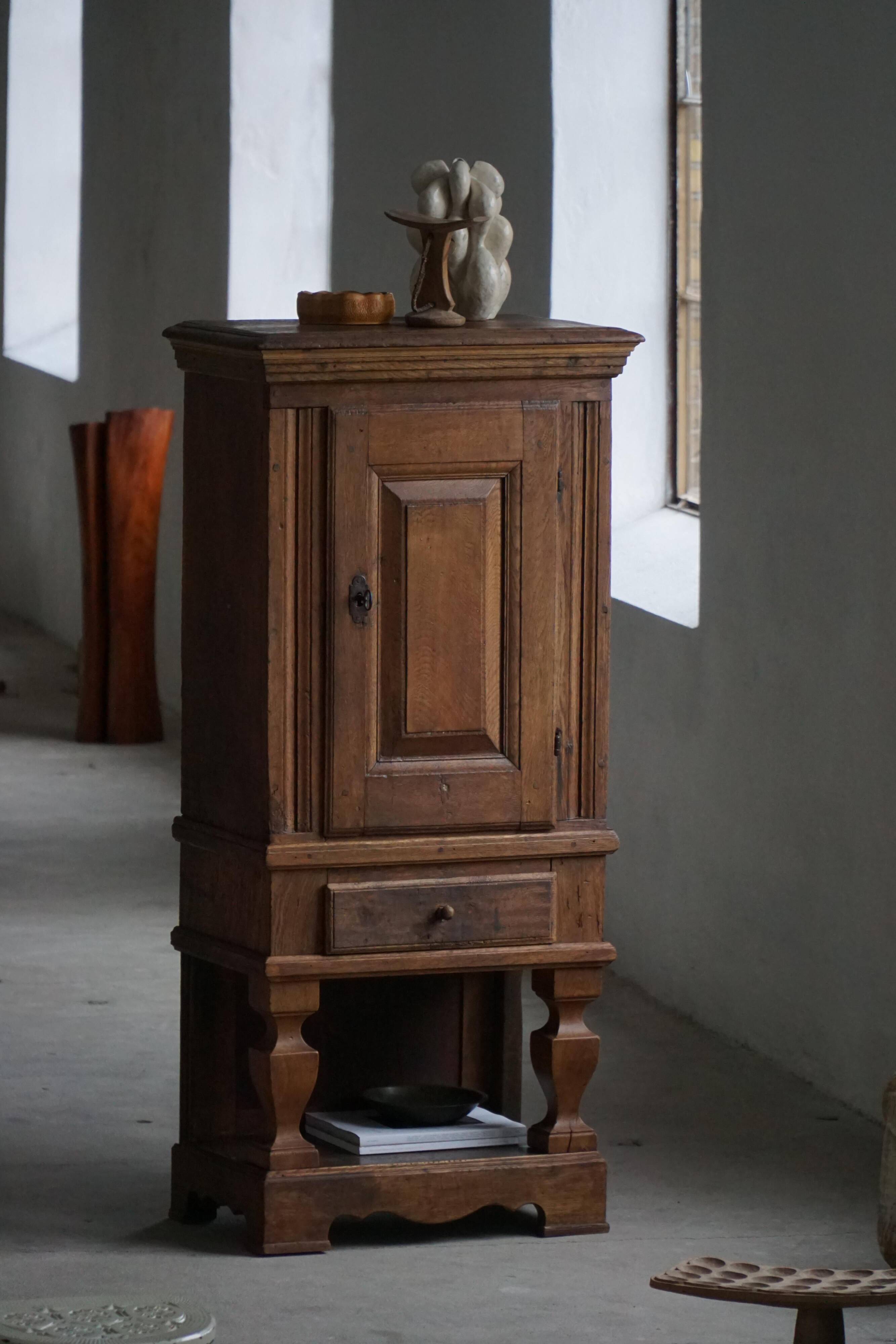 French rustic furniture in solid oak from the mid-19th century with panelled doors, baroque style.