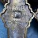 Pair of bronze wall sconces with mask, signed L. Pinet, Art Nouveau period.