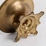 Vintage brass ashtray from the 1940s with a nude boy figurine on a footed base.