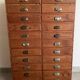 Old apothecary trade furniture in vintage wood 24 drawers.