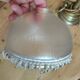 Retro brass lamp with a glass shade and bead fringes.