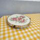 Turntable with earthenware pastry and bakelite floral decoration