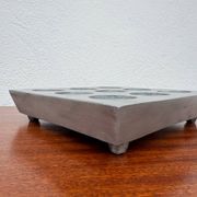 Brutalist style brushed aluminum candle holder