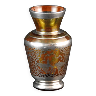 Old small glass vase decorated with silver