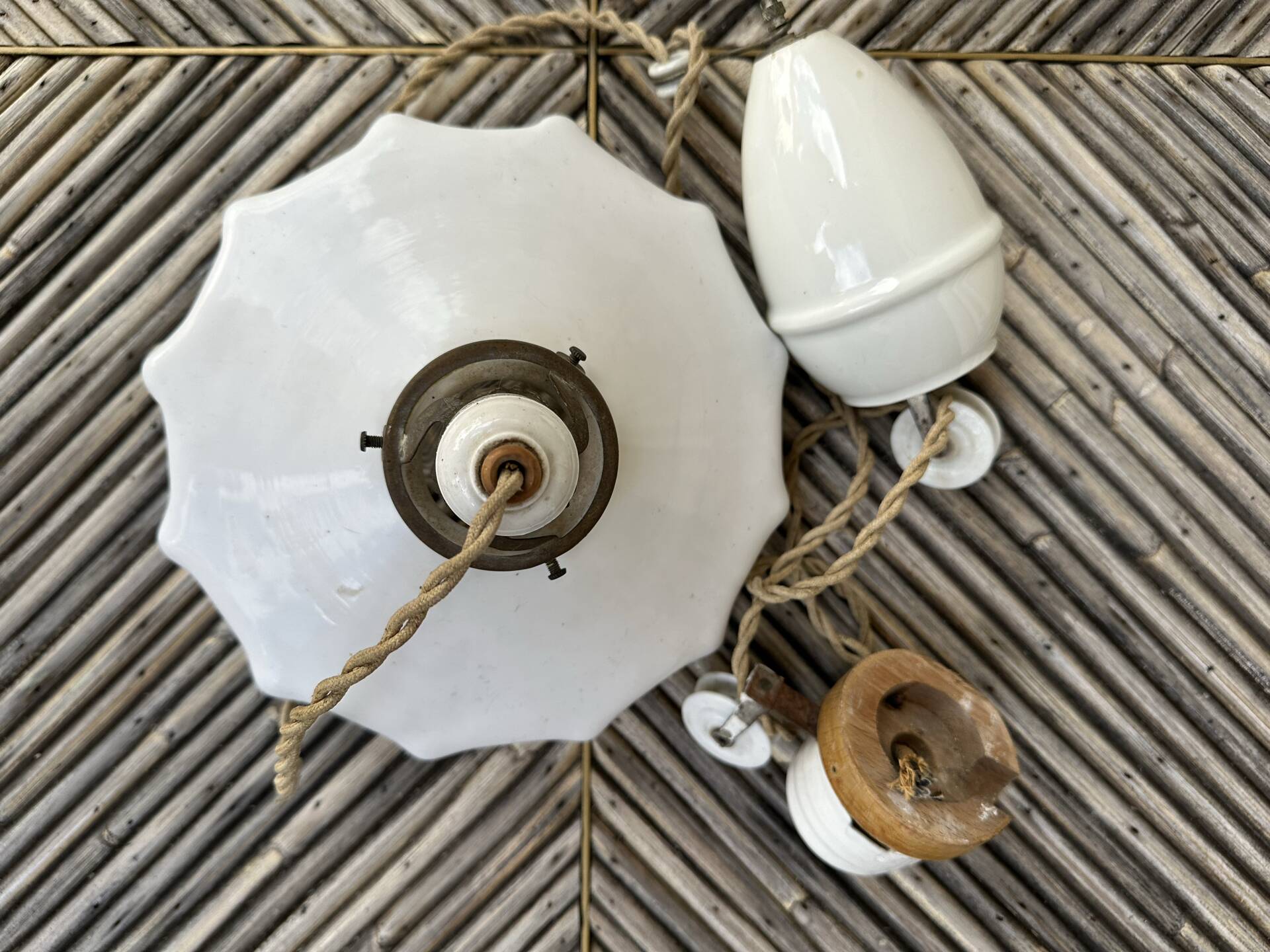 Vintage pleated opaline suspension with porcelain fittings.