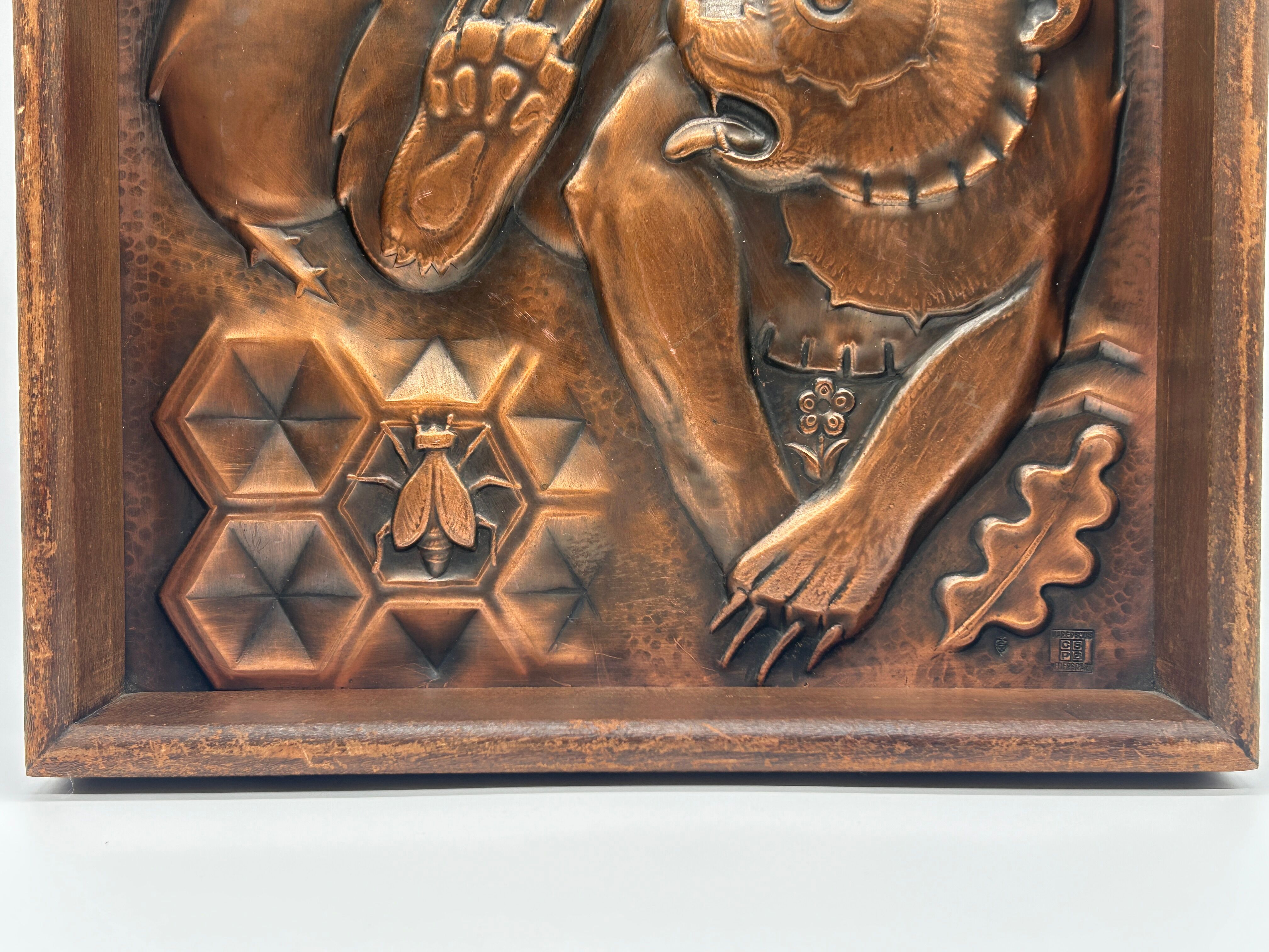 Art Deco bas-relief in Maredsous brasswork.