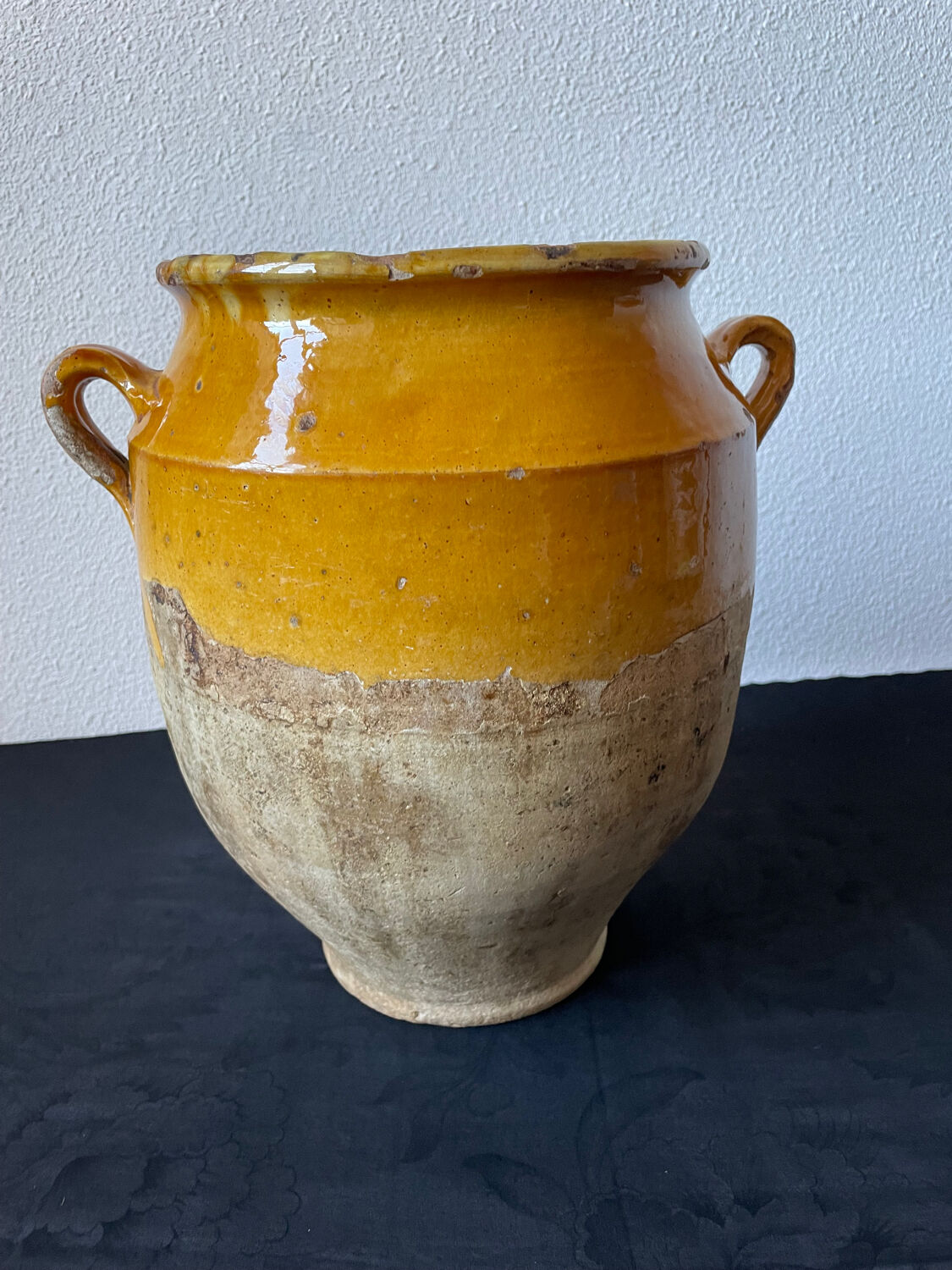 Old yellow glazed terracotta grease pot south west France