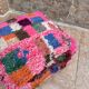 Berber floor pouf: Handwoven Moroccan wool cushion.