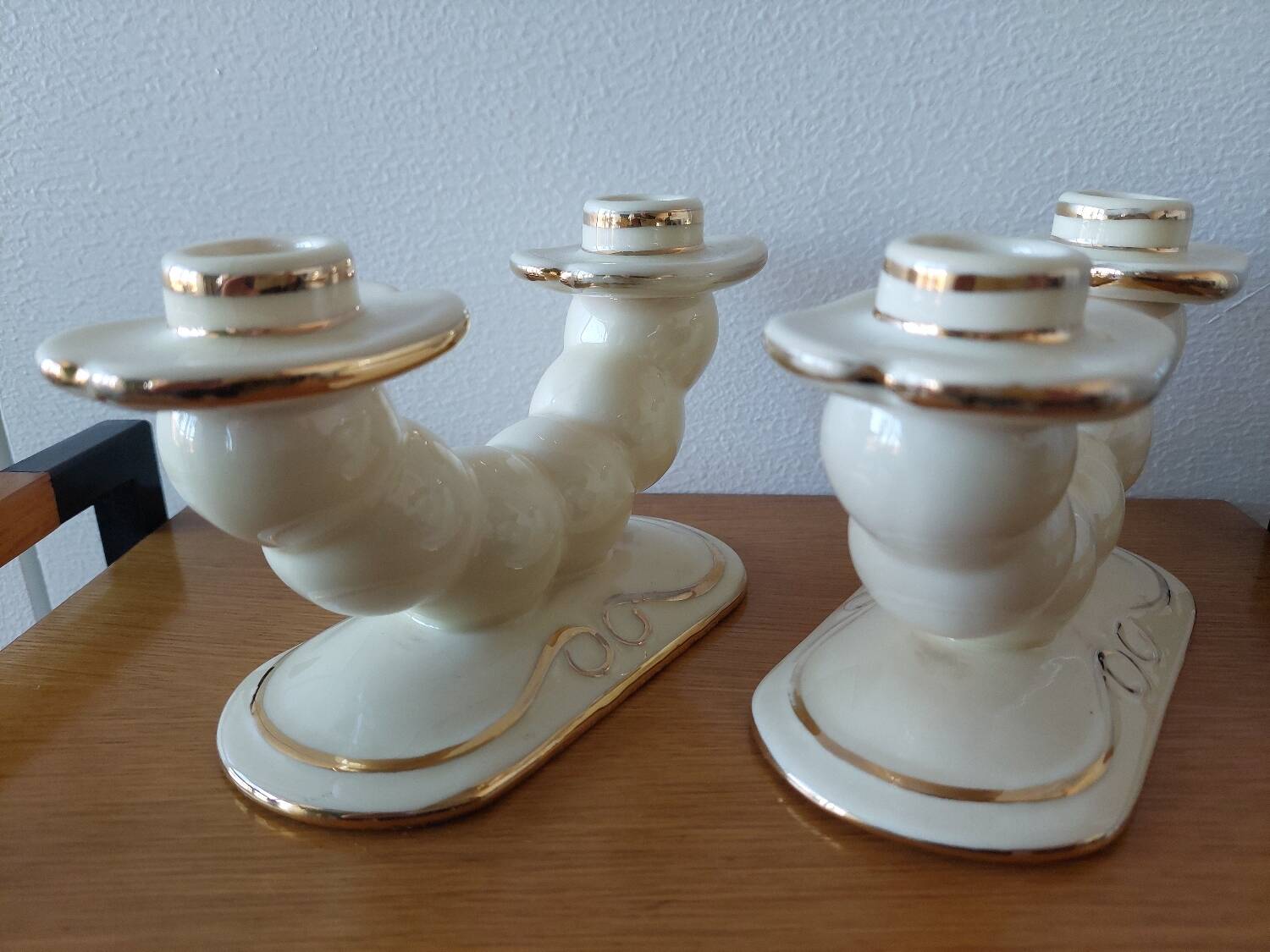Pair of cream ceramic candlesticks with gold trim circa 1930-1950