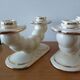 Pair of cream ceramic candlesticks with gold trim circa 1930-1950