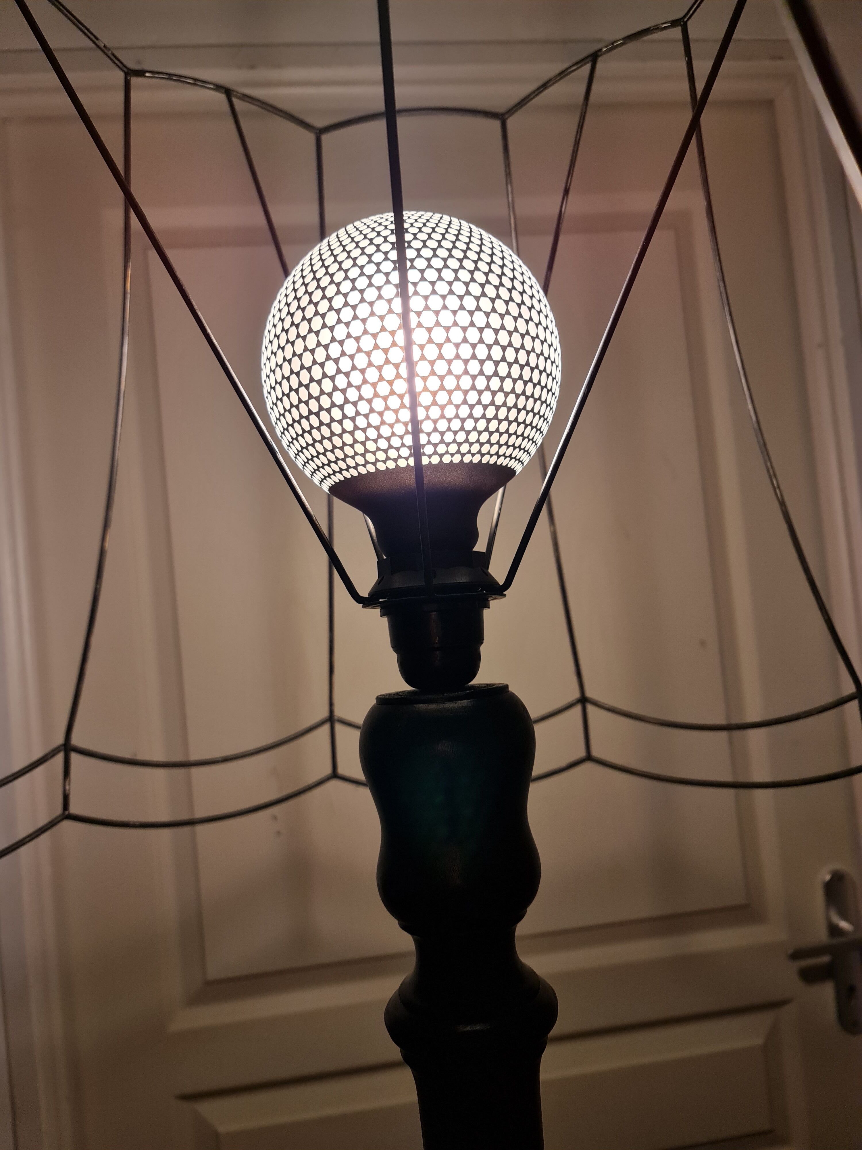 Matte black lamppost with small tablet