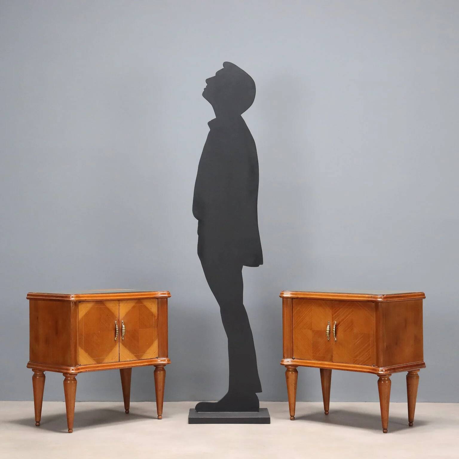 Pair of wooden and glass bedside tables from the 1950s.