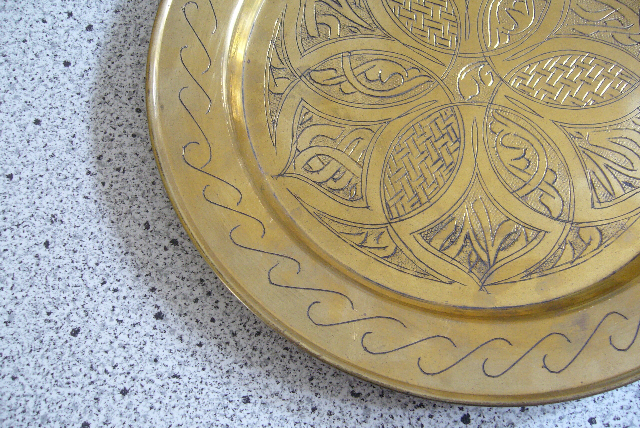 Oriental style chiseled metal plate