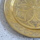 Oriental style chiseled metal plate
