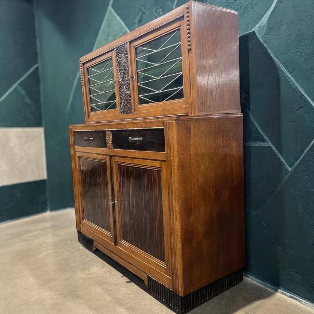 Vintage Art Deco display cabinet in wood with green stained glass.