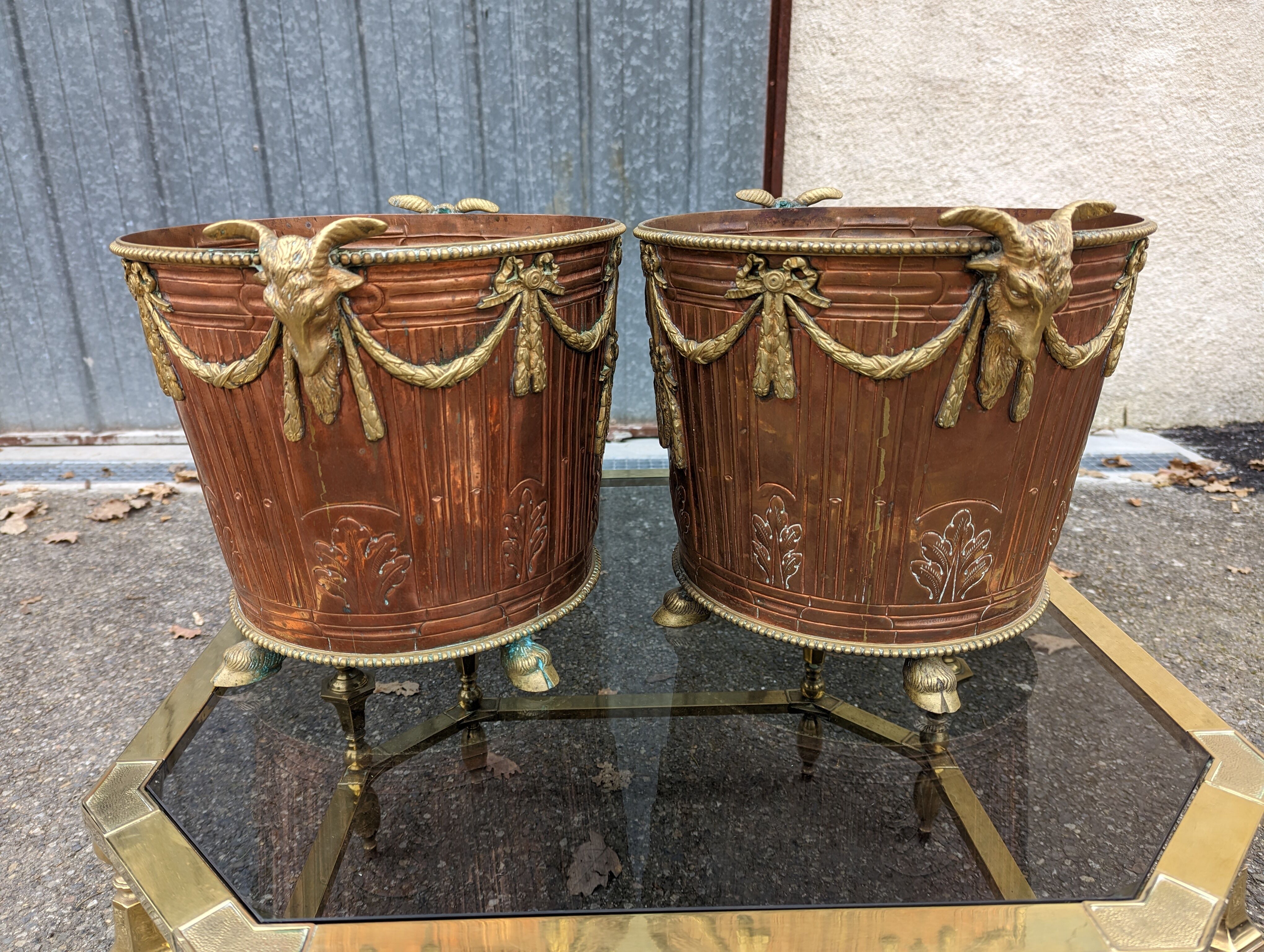 Pair of brass and bronze planters rams' heads 1890