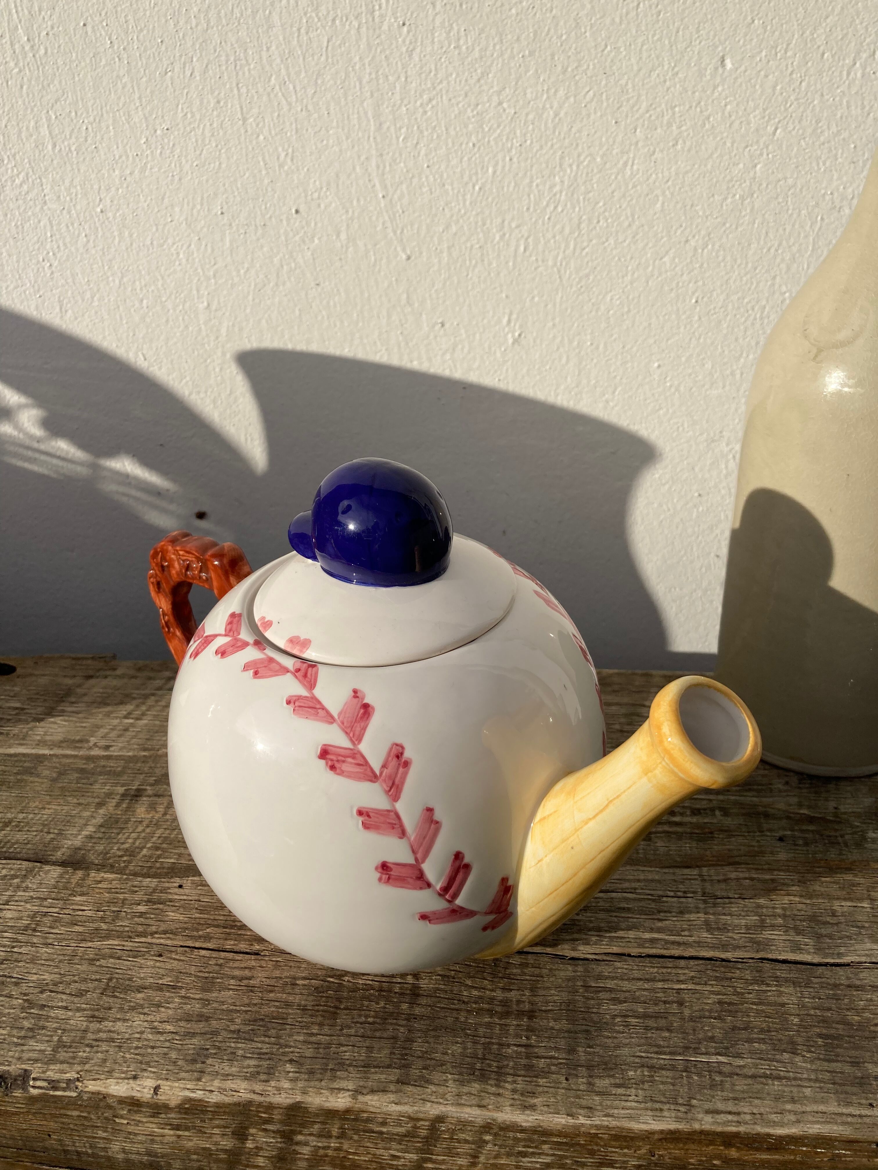 Teapot in white ceramic baseball