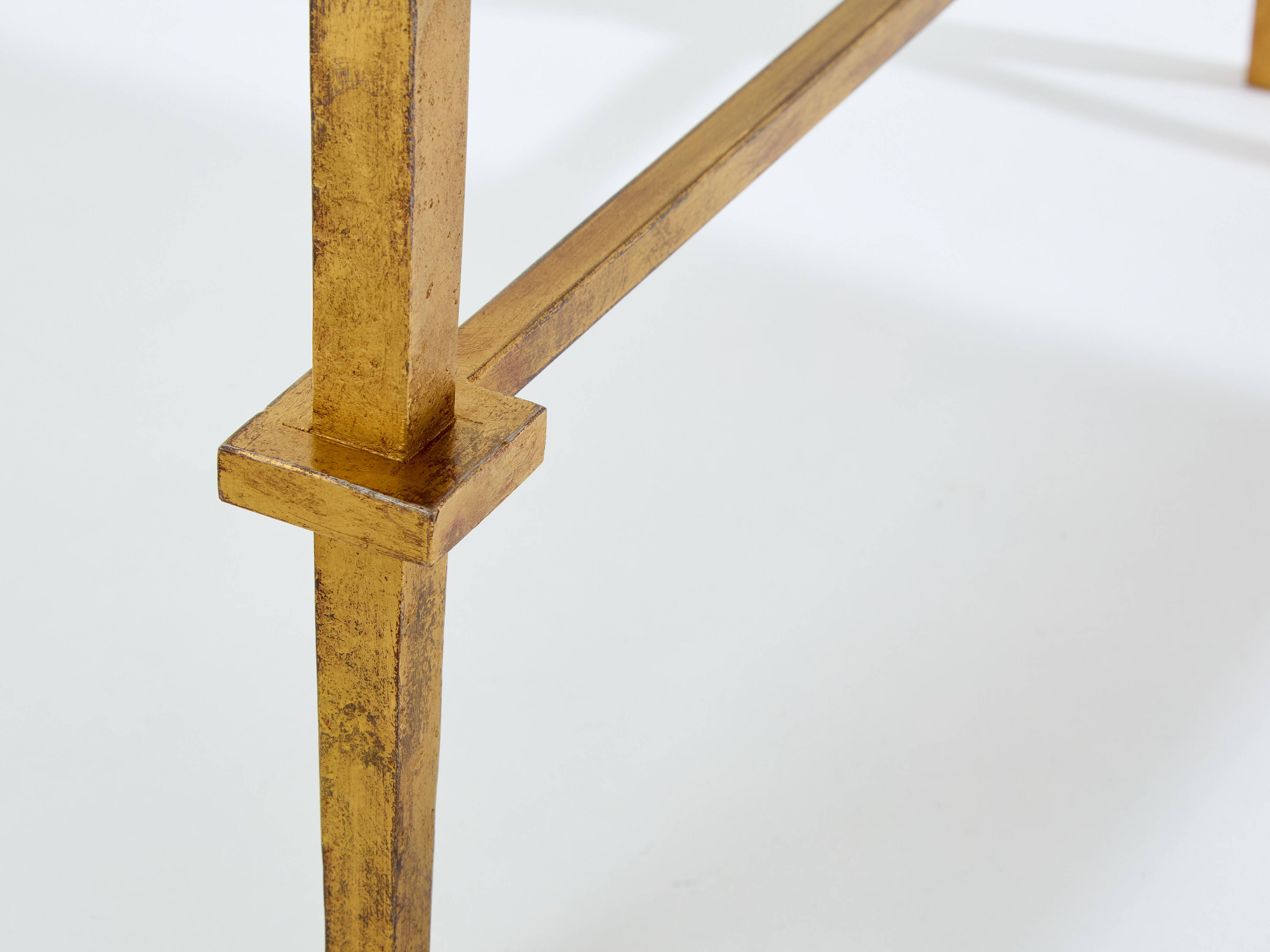 Pair of side tables in gilded iron and black lacquer Maison Ramsay 1950