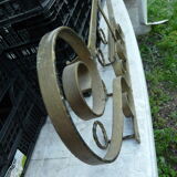 Wall mounted wrought iron coat rack from the 1970s