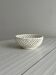 white openwork ceramic cup