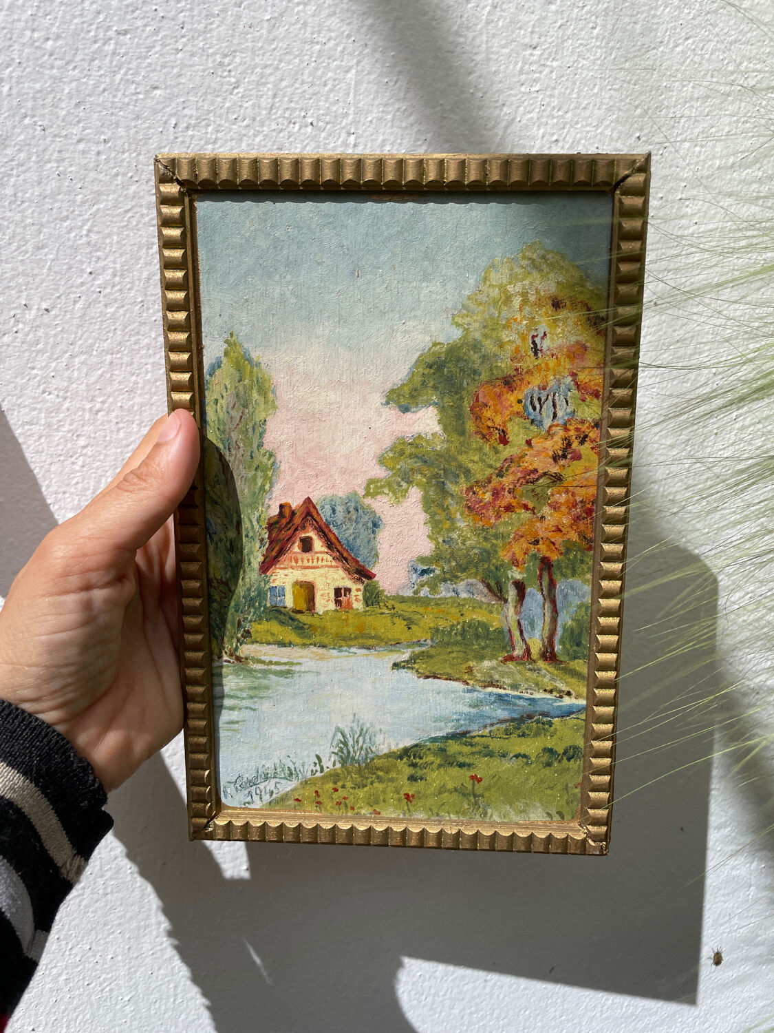 Small landscape painting with golden frame