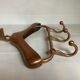 Coat rack gilded metal hanger varnished