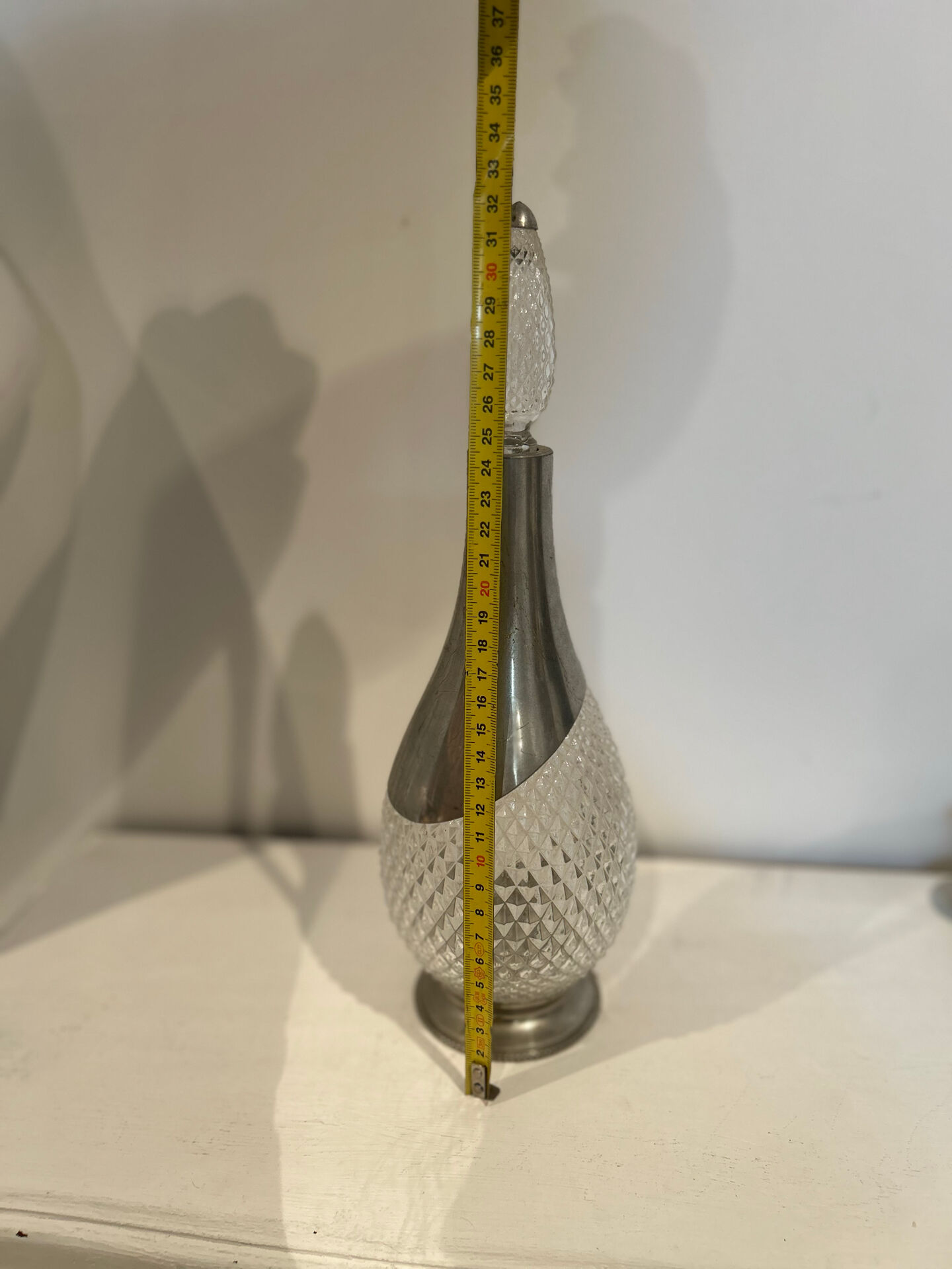 Cut glass carafe and pewter