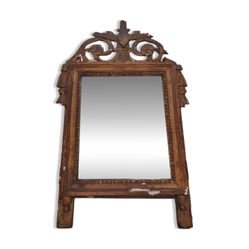 Golden wood and stucco mirror, Louis XVI style, 19th century.