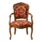 Louis XV style armchair in solid wood with red and gold damask fabric.