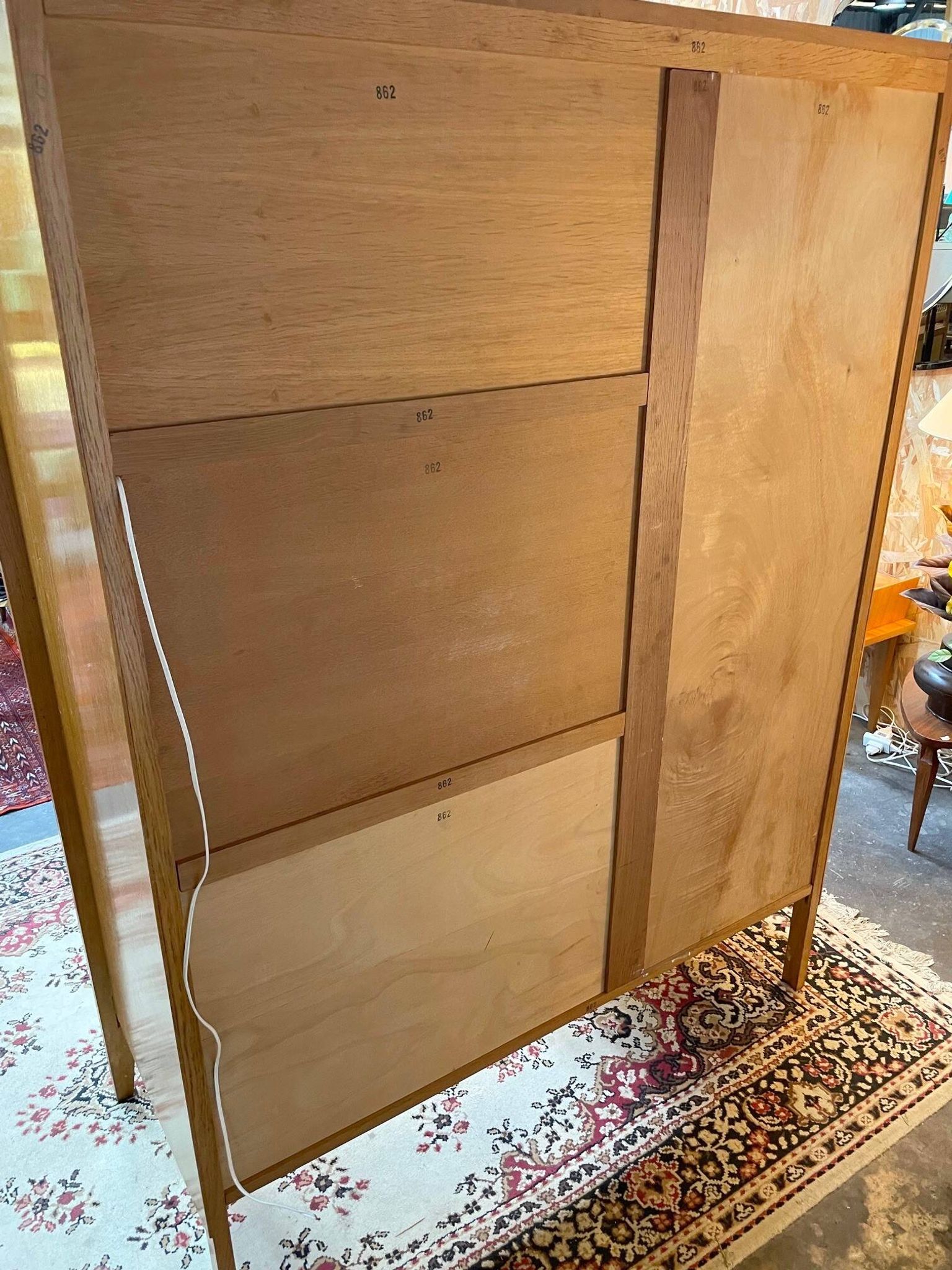 Wardrobe, desk, wooden and rattan chest of drawers, 1960s.