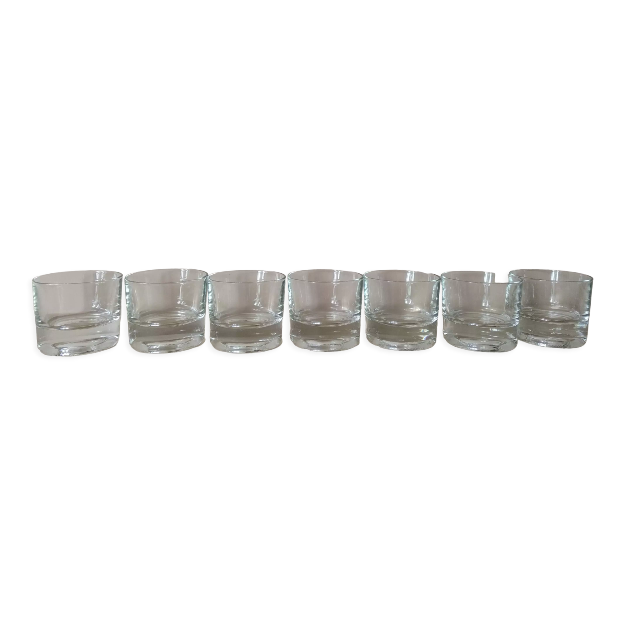 Glasses cups with thick bottom with water or vintage spirits 70