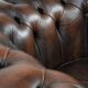 Brown Chesterfield armchair made of cowhide leather in English style