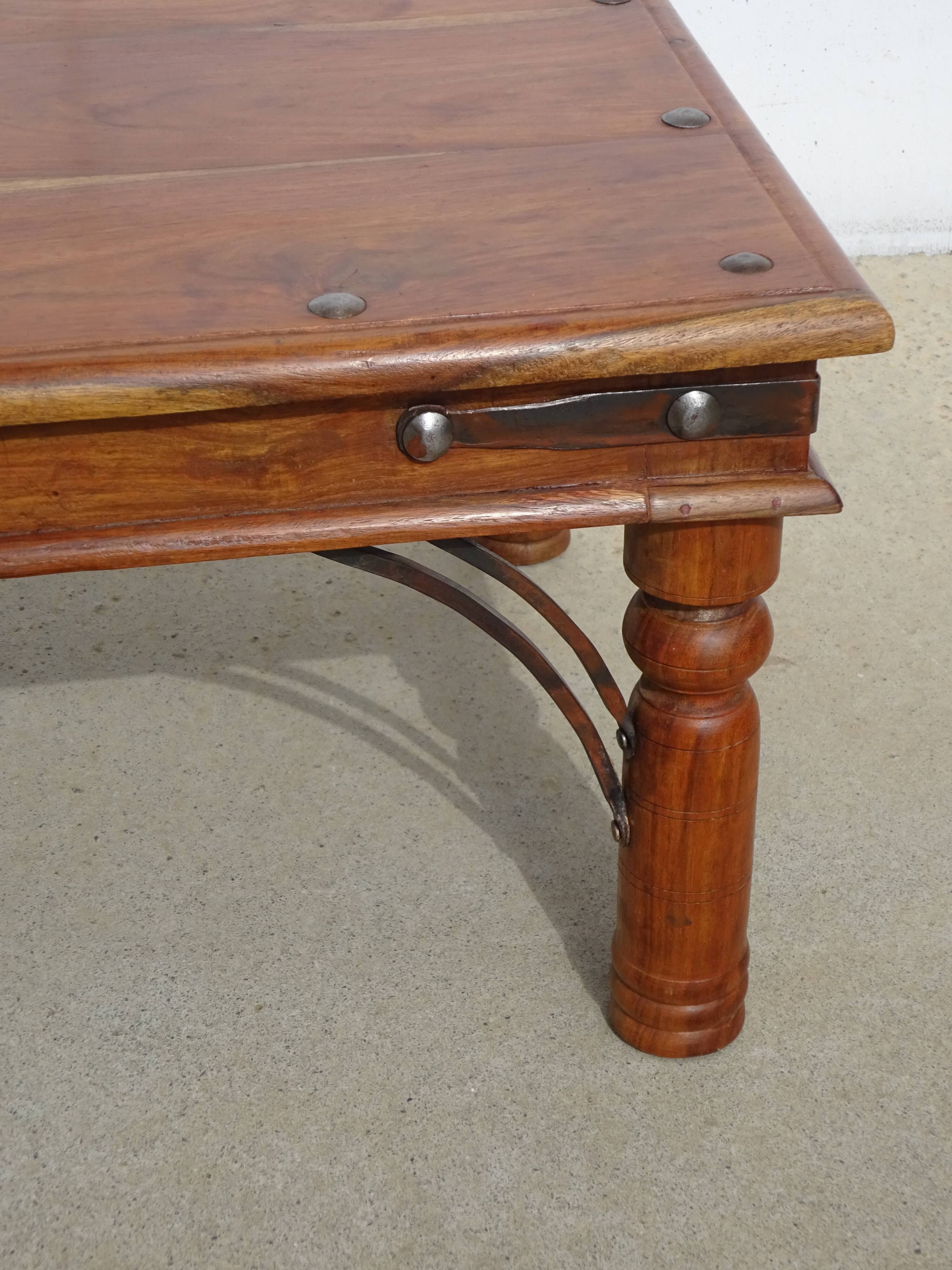 Square coffee table in exotic wood and wrought iron.