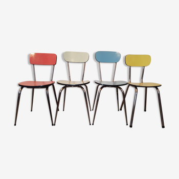 Four formica chairs of different colors
