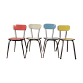 Four formica chairs of different colors