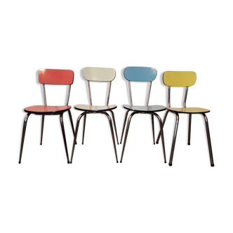 Four formica chairs of different colors