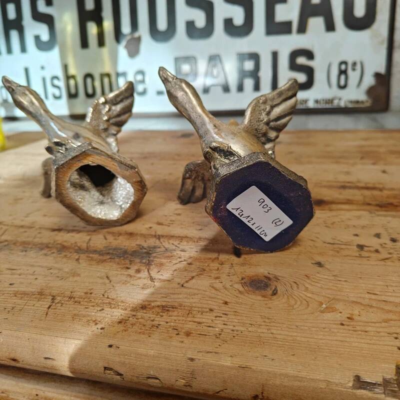 Set of two antique silver-plated duck candlesticks.