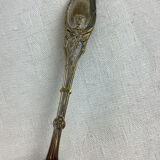 Old sprinkling spoon
