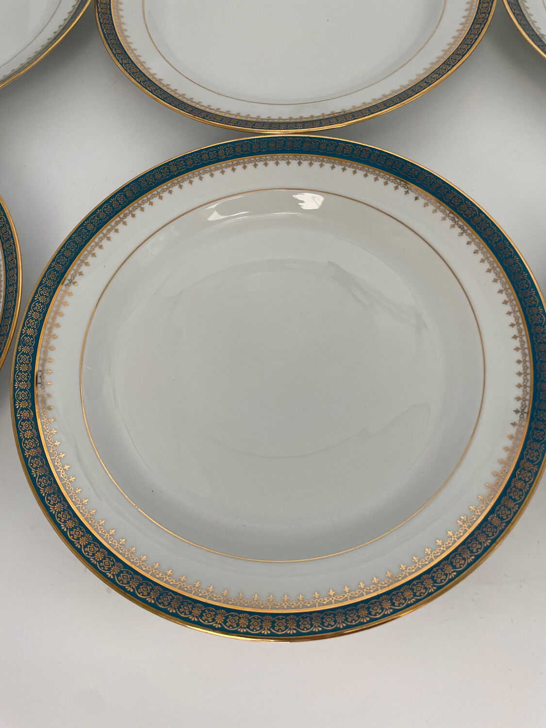 Six slightly hollow Limoges porcelain plates.