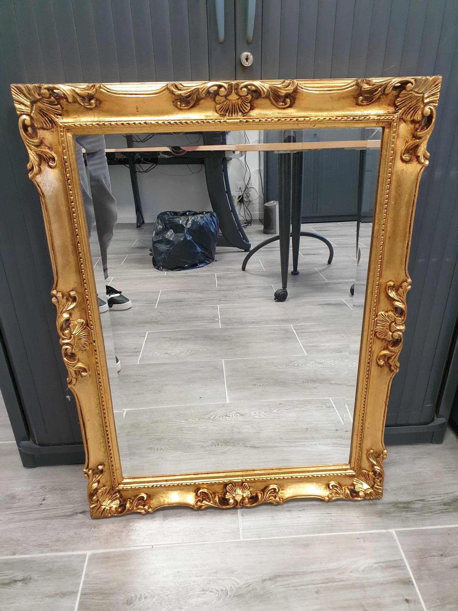 Beveled mirror and golden wood