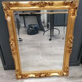 Beveled mirror and golden wood