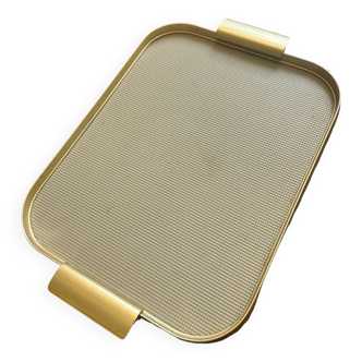 Plastic tray and vintage brass