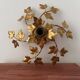 Applique murale feuilles fleurs en métal doré