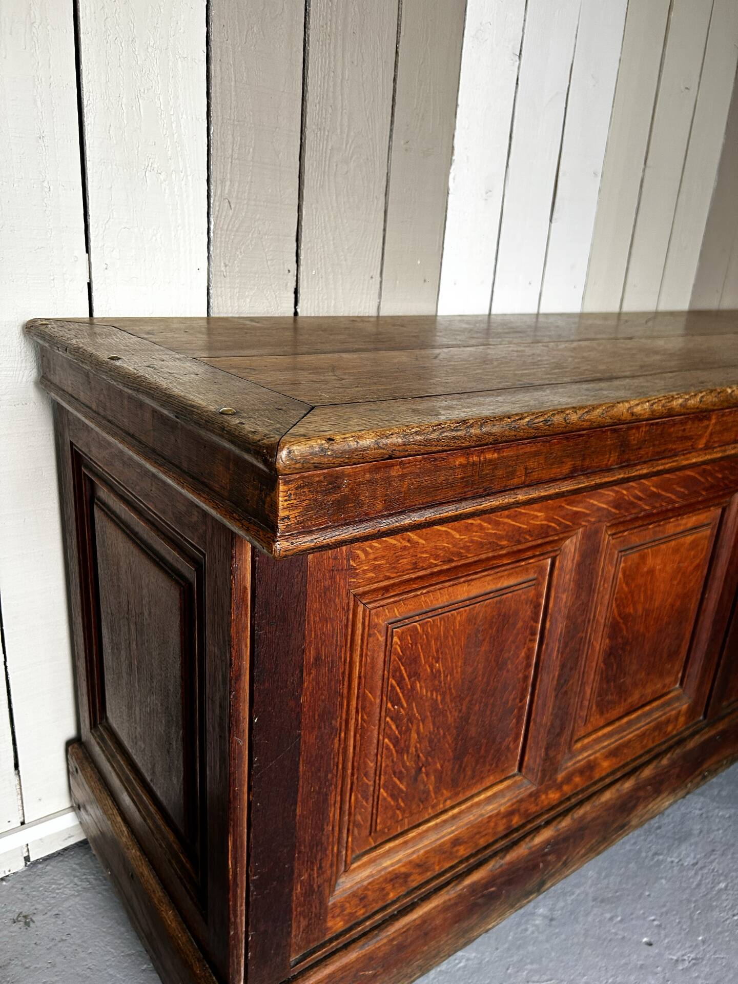 Large antique haberdashery counter in oak