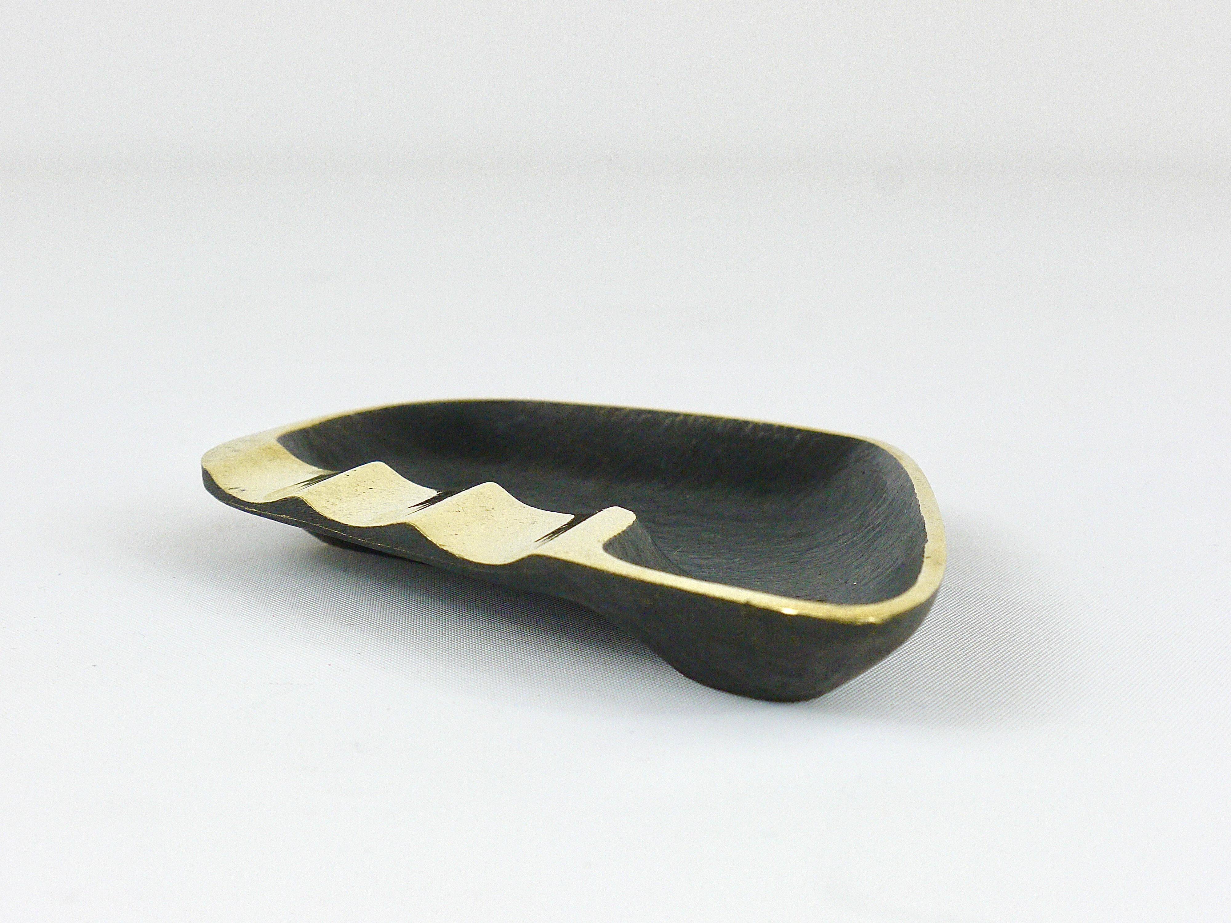 Asymmetrical modernist ashtray by Walter Bosse in black brass by Herta Baller, 1950s.