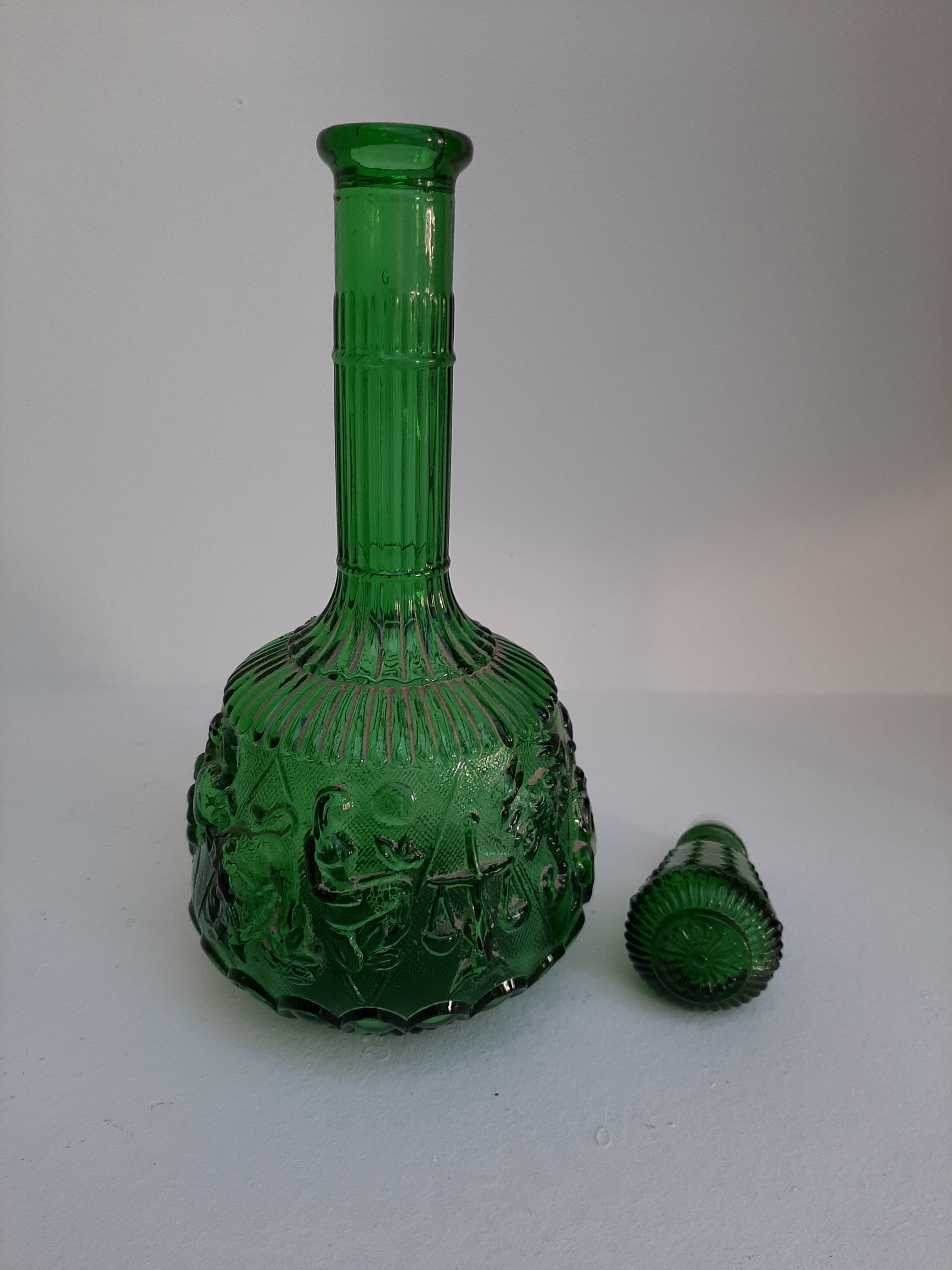 Empoli green glass bottle, zodiac signs